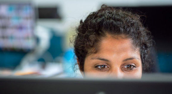 Woman looking at a computer screen